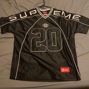 Supreme black paneled football jersey.